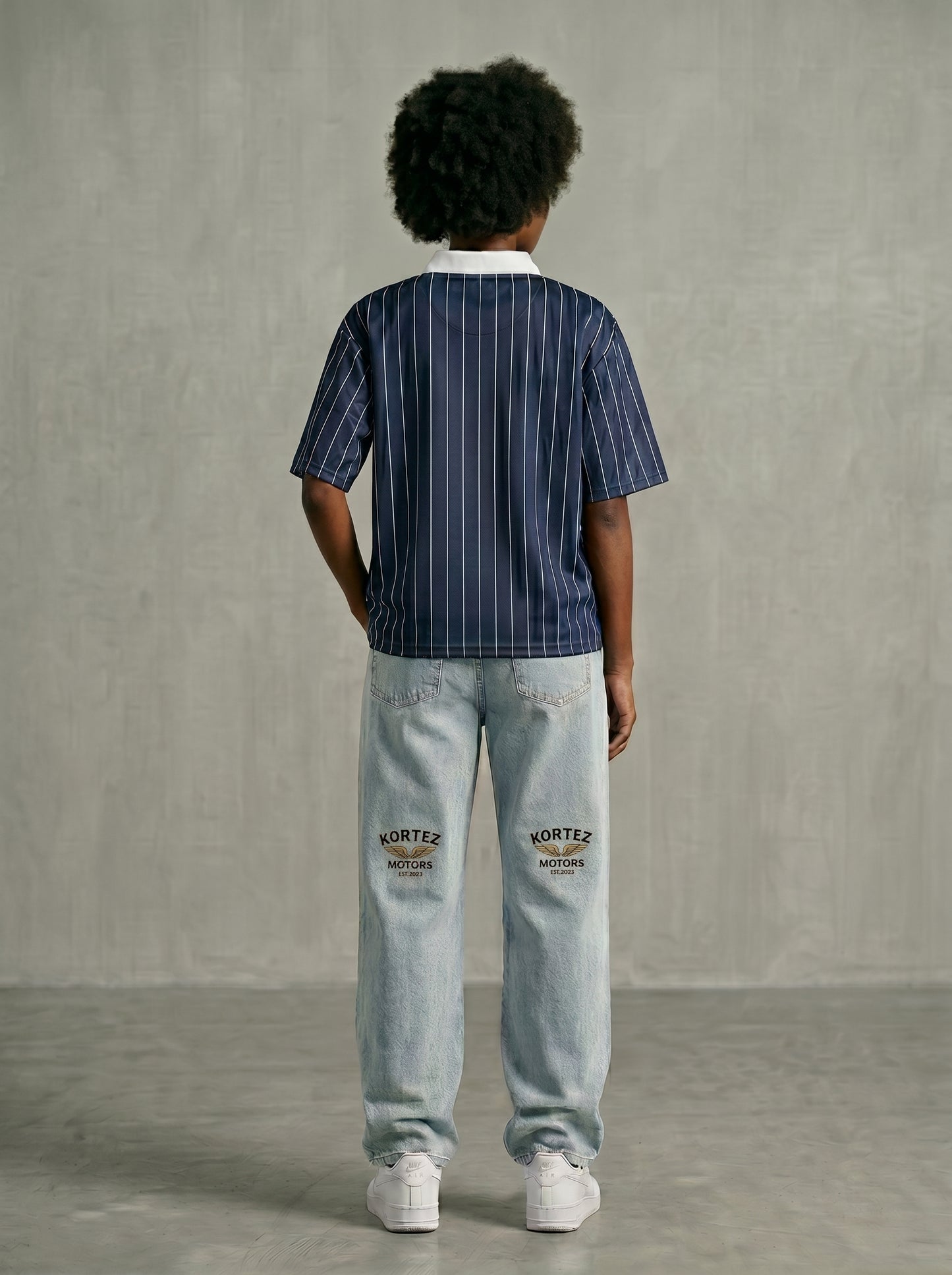 Navy blue pinstripe collared shirt back view with hands behind back