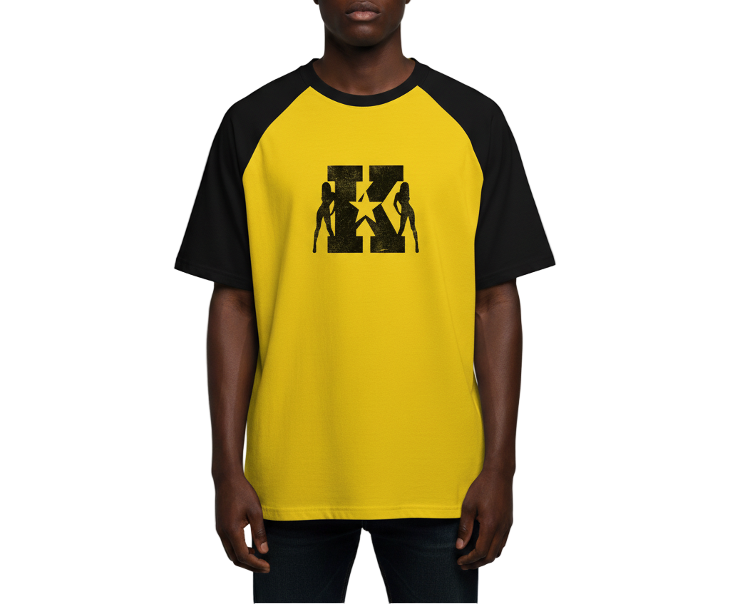 Man wearing a yellow and black baseball shirt with a graphic design on a gray background