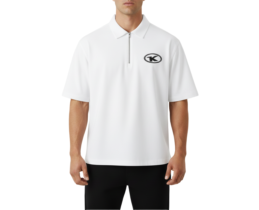 Man wearing a white polo shirt with a logo on a light gray background